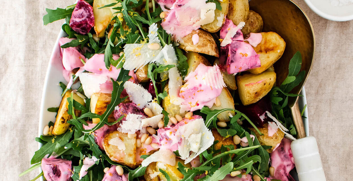 Roasted potatoes with arugula and creamy beets that will satisfy a crowd! A wholesome and simple vegetarian meal that comes together in 40 minutes!
