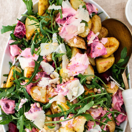 Roasted potatoes with arugula and creamy beets that will satisfy a crowd! A wholesome and simple vegetarian meal that comes together in 40 minutes!