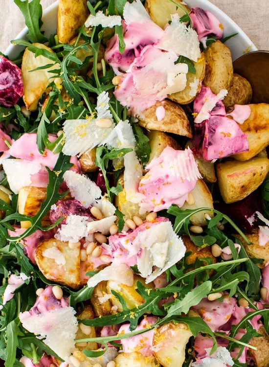 Roasted potatoes with arugula and creamy beets that will satisfy a crowd! A wholesome and simple vegetarian meal that comes together in 40 minutes!