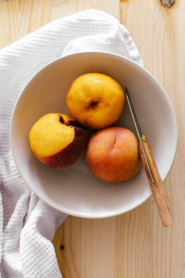 peeled ripe peaches in a bowl