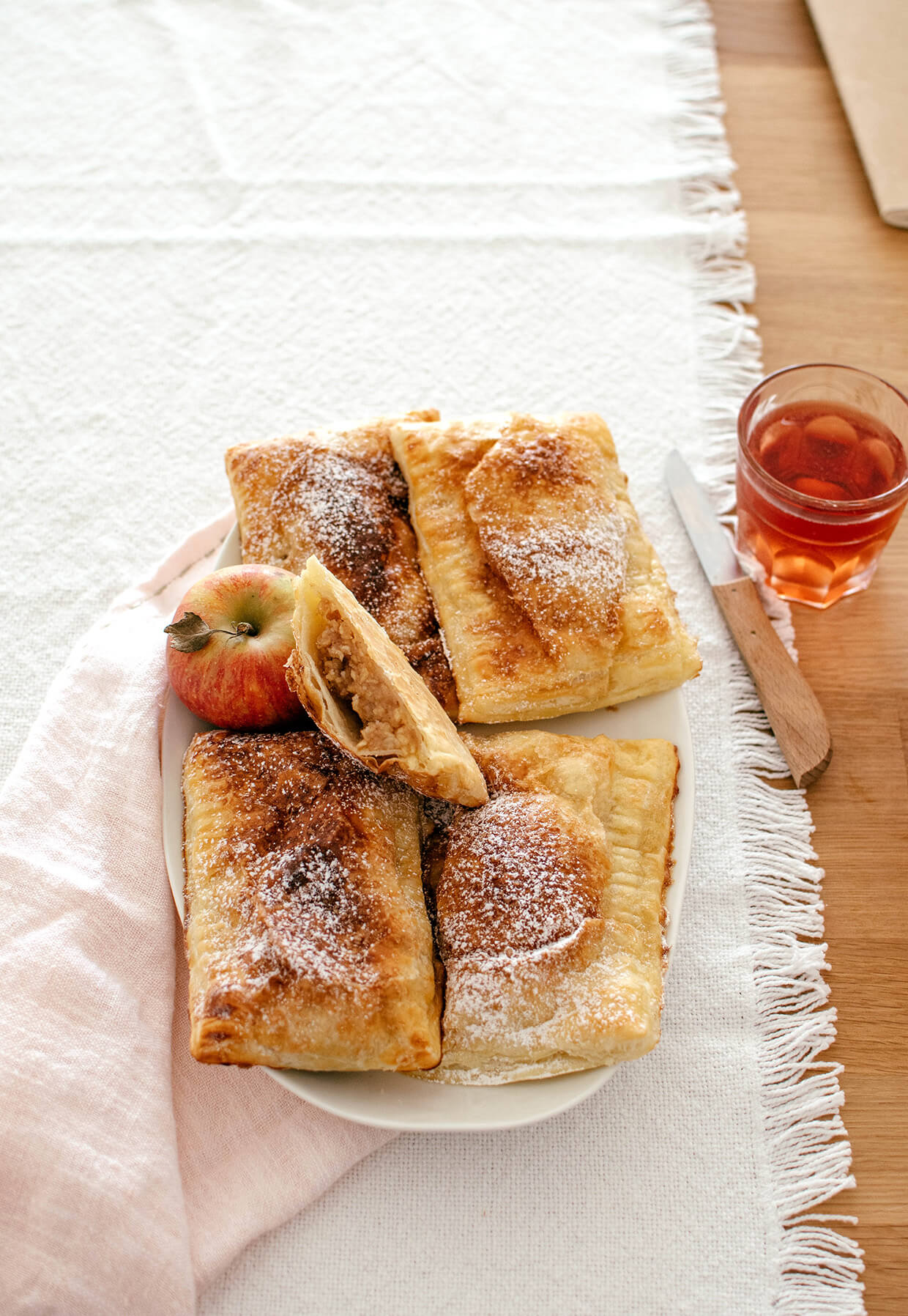 puff pastry apple hand pies on a plate
