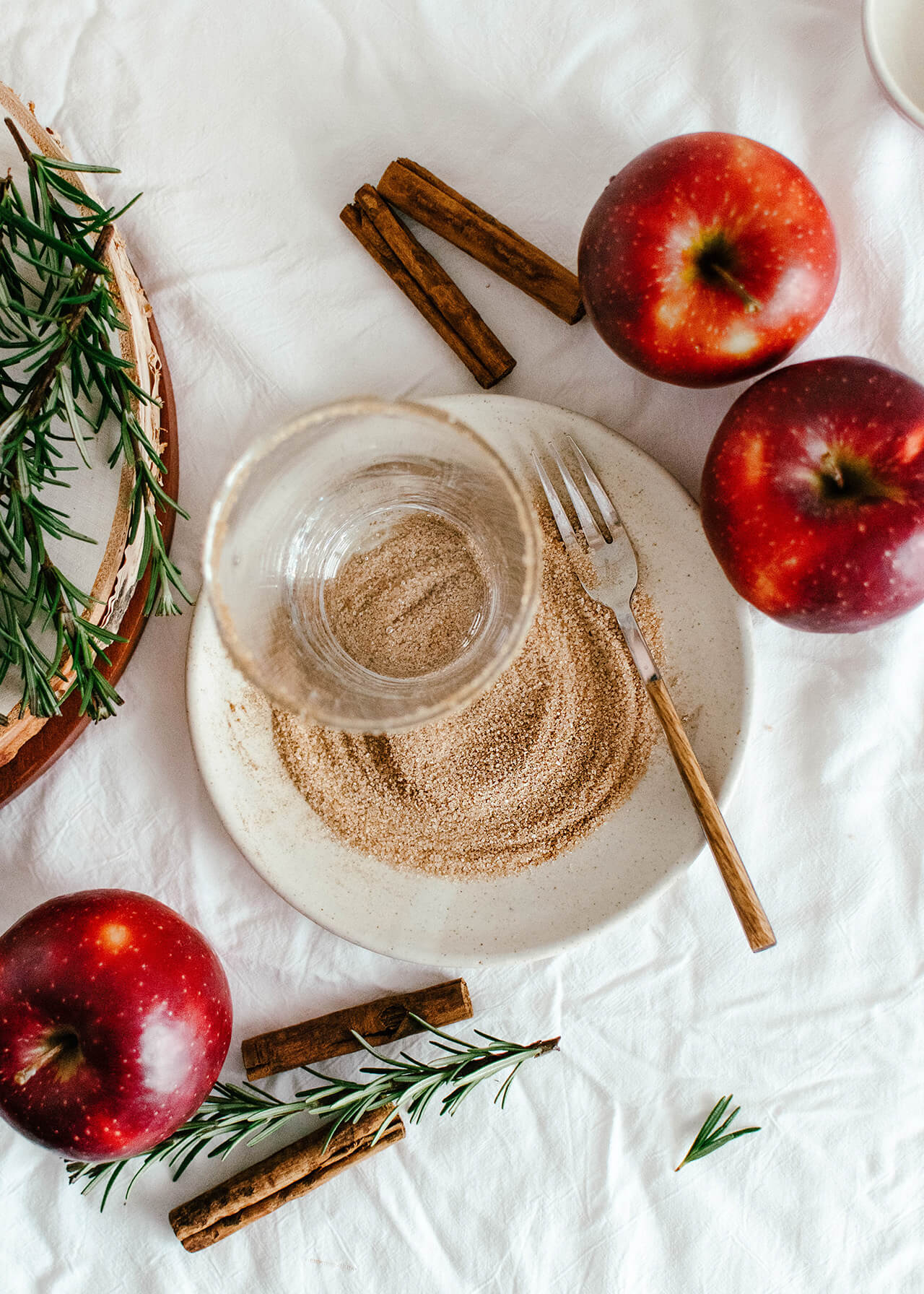 cocktail ingredients, apples, sugar on plate