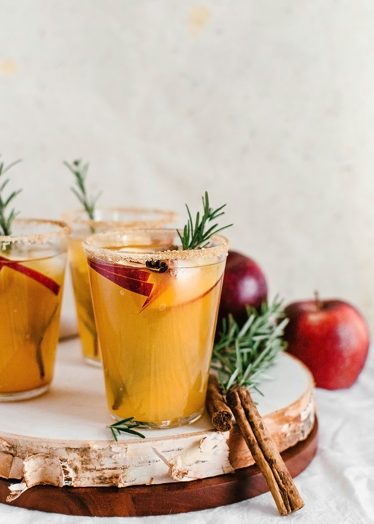 apple cider margaritas on wooden tray