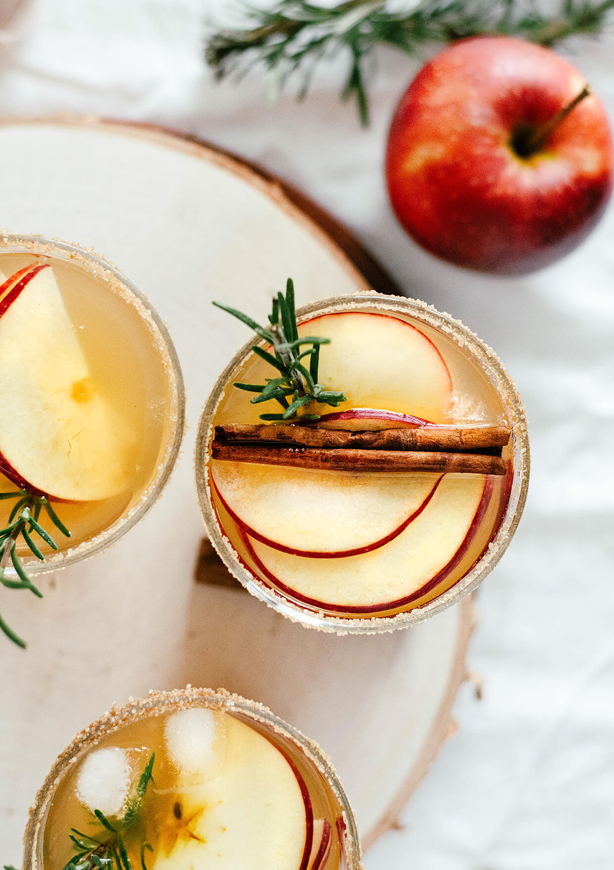 apple cider margaritas on wooden tray