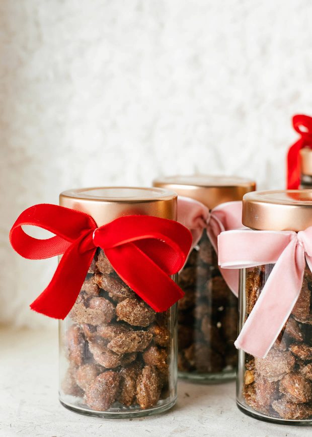 roasted almonds in glass jar with red velvet ribbon