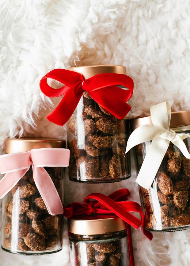 cinnamon roasted almonds in glass jars with velvet ribbon