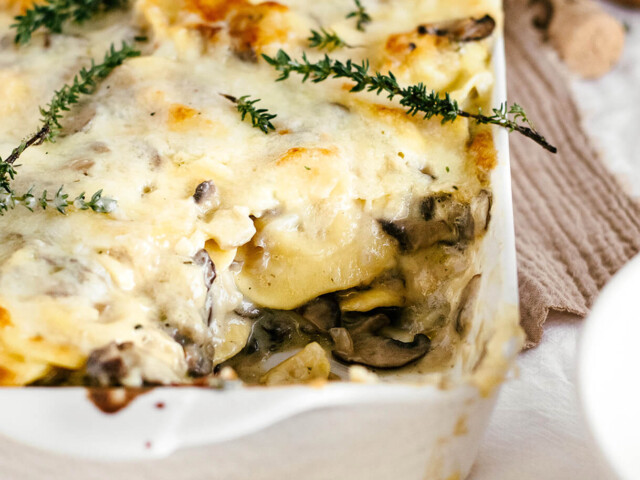 easy cheesy mushroom baked ravioli in a serving dish