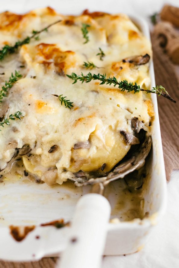 baked ravioli with serving spoon
