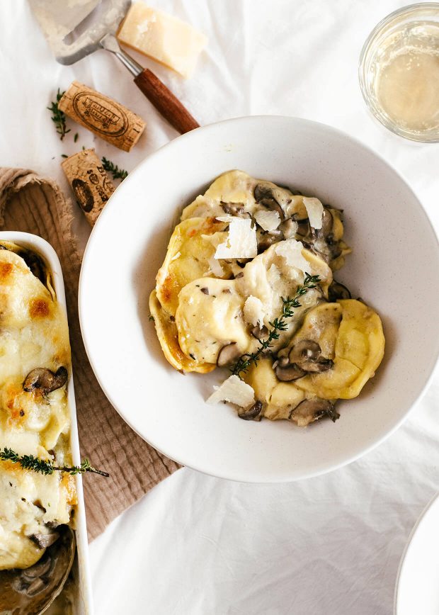 easy cheesy mushroom baked ravioli, served in bowl