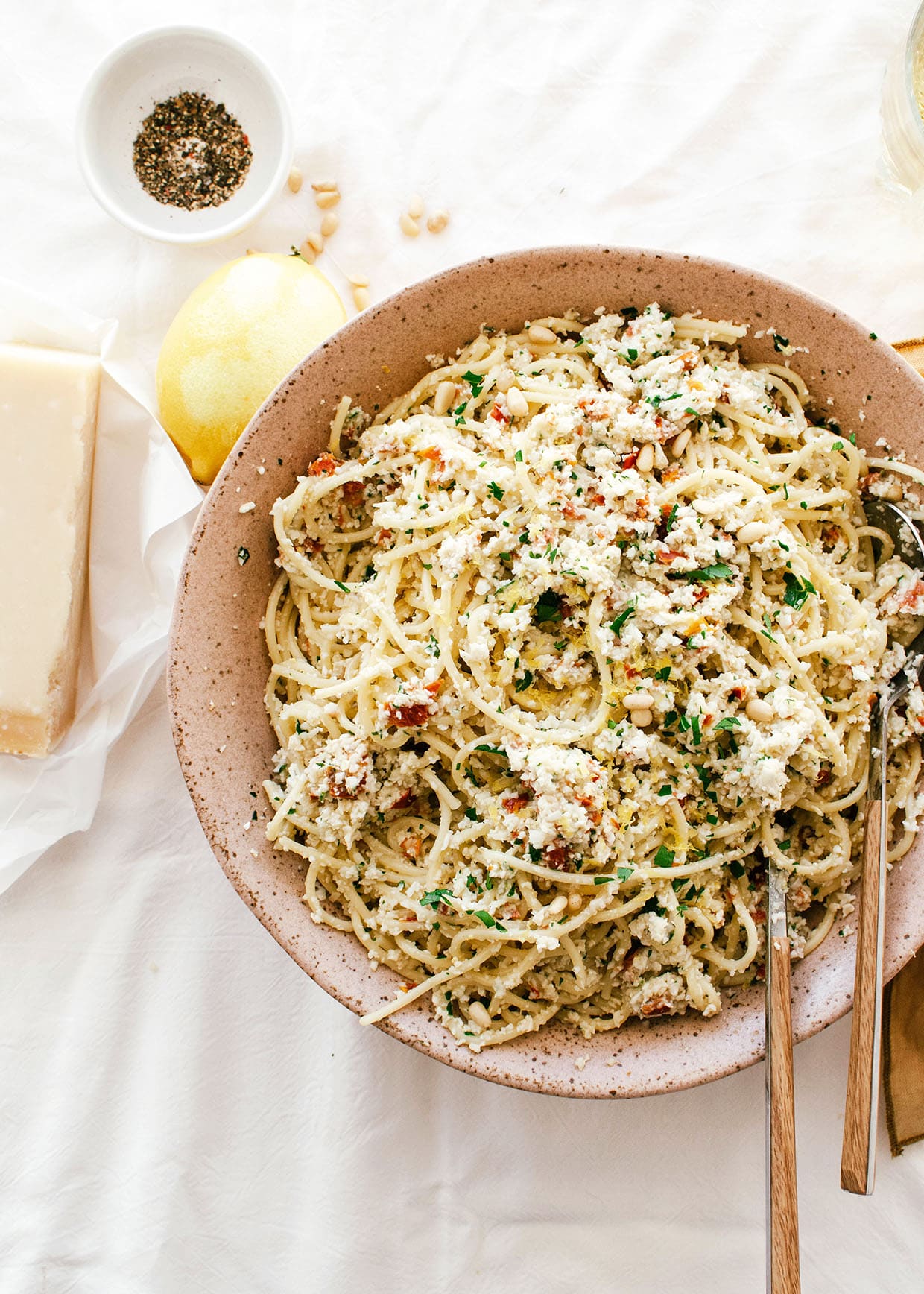 cooked pasta with pesto in large bowl