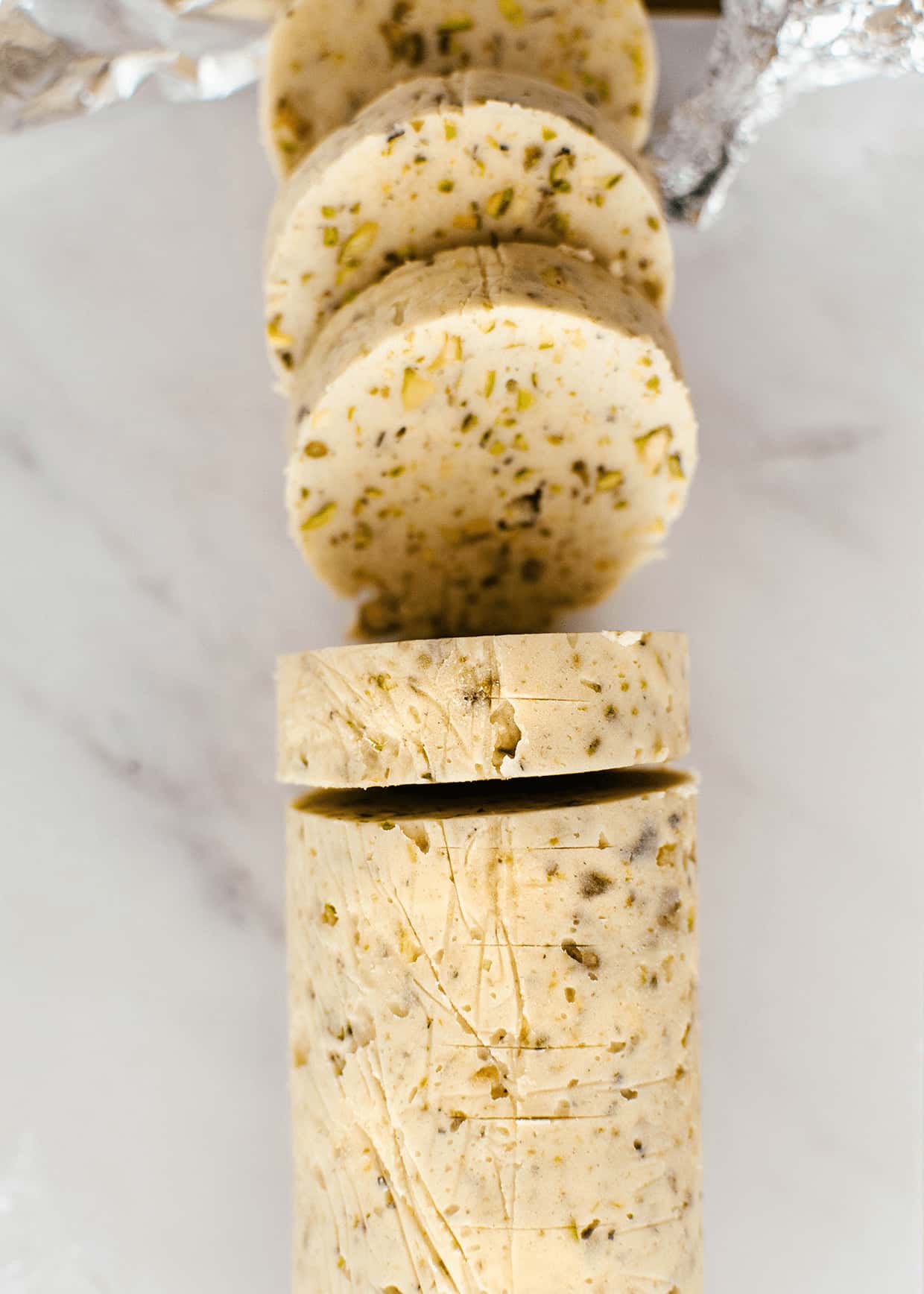 sliced log of rolled cookie dough