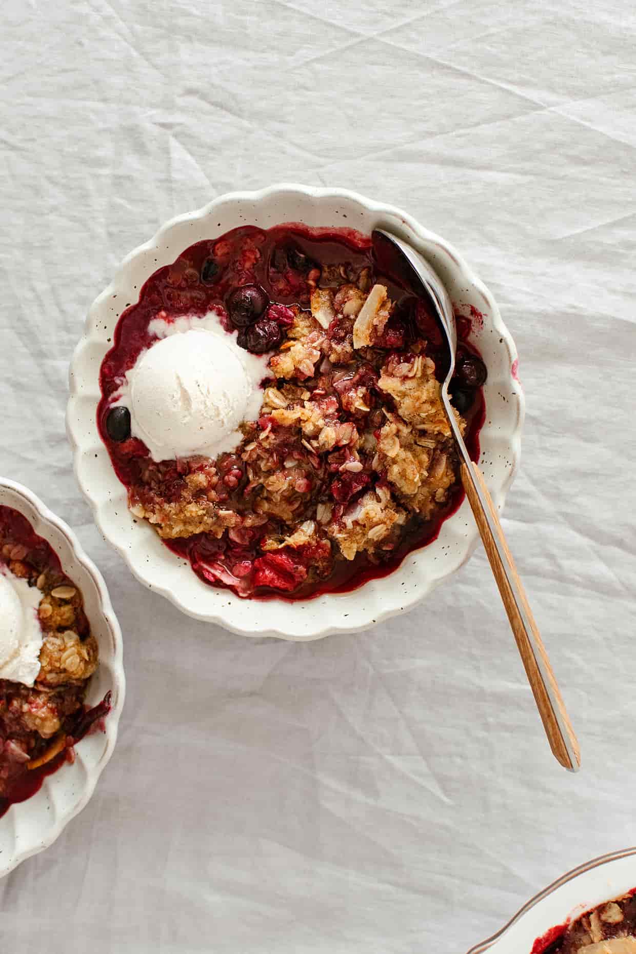 plum blueberry coconut crisp with ice cream