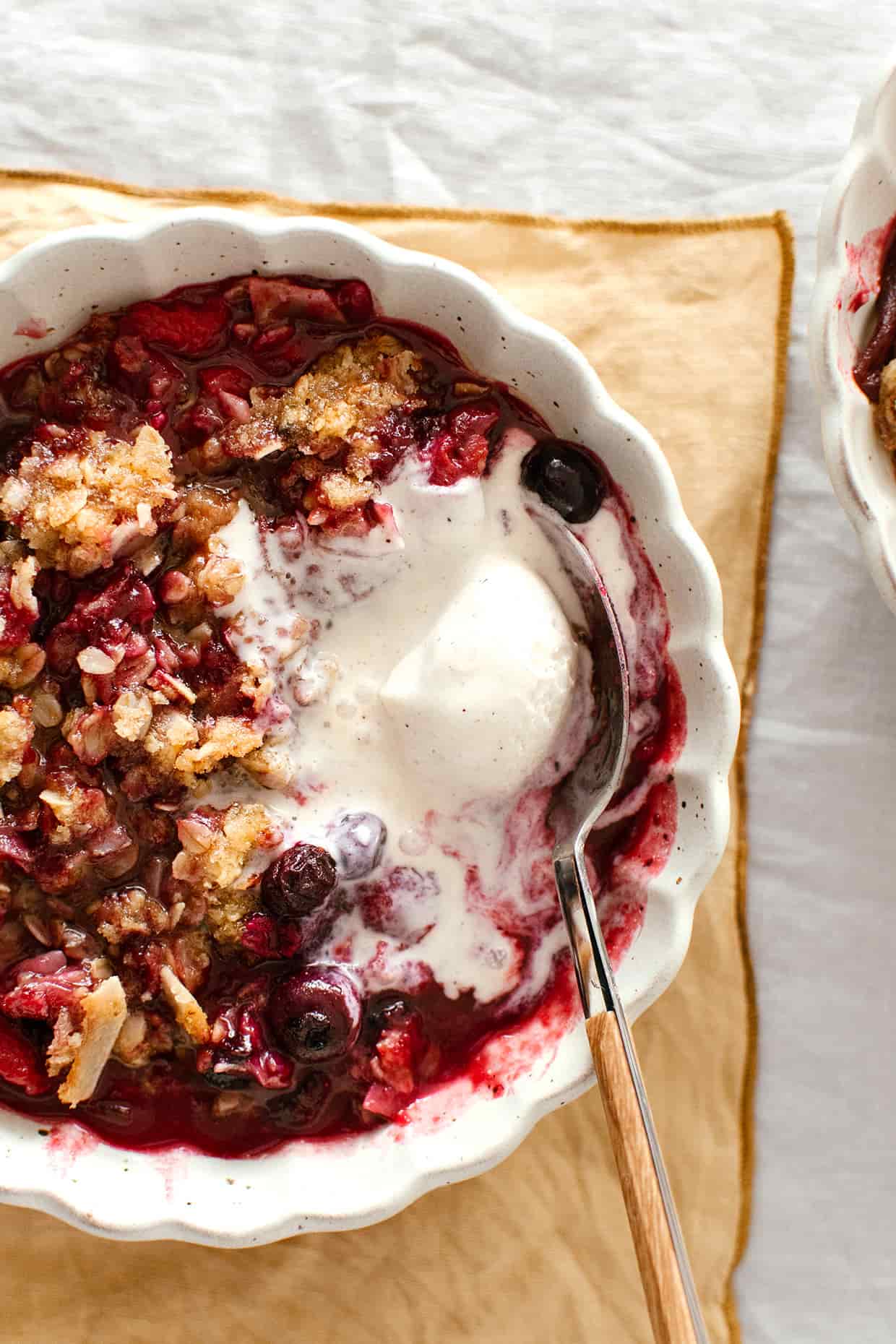 fruit crisp with vanilla ice cream served in a bowl