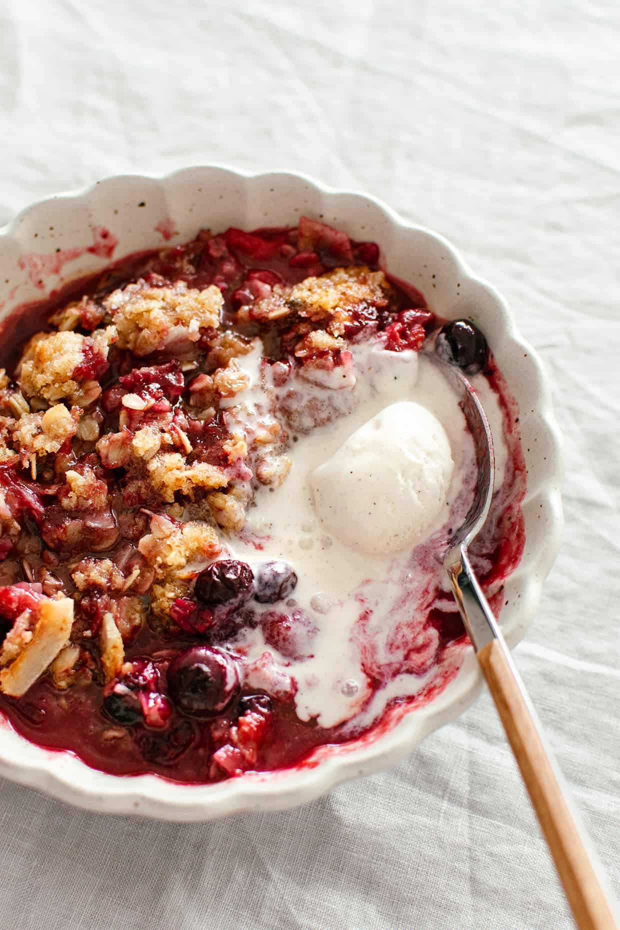 plum blueberry coconut crisp with vanilla ice cream