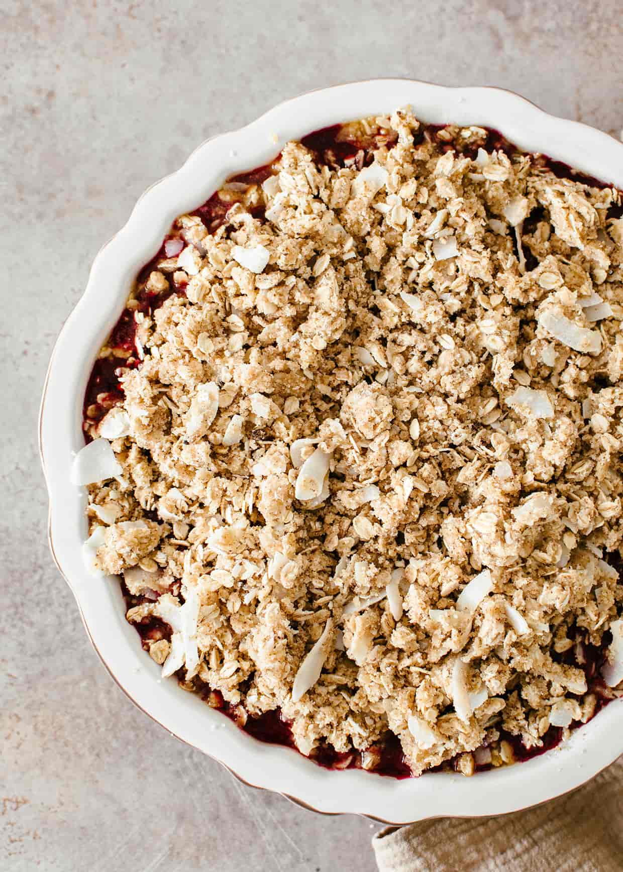 fruit crisp with oat topping before baking