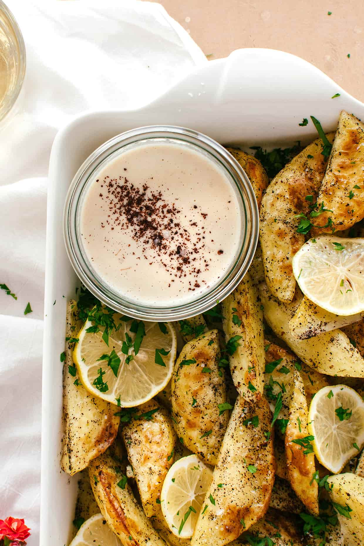 close view of a glass bowl with tahini dipping sauce