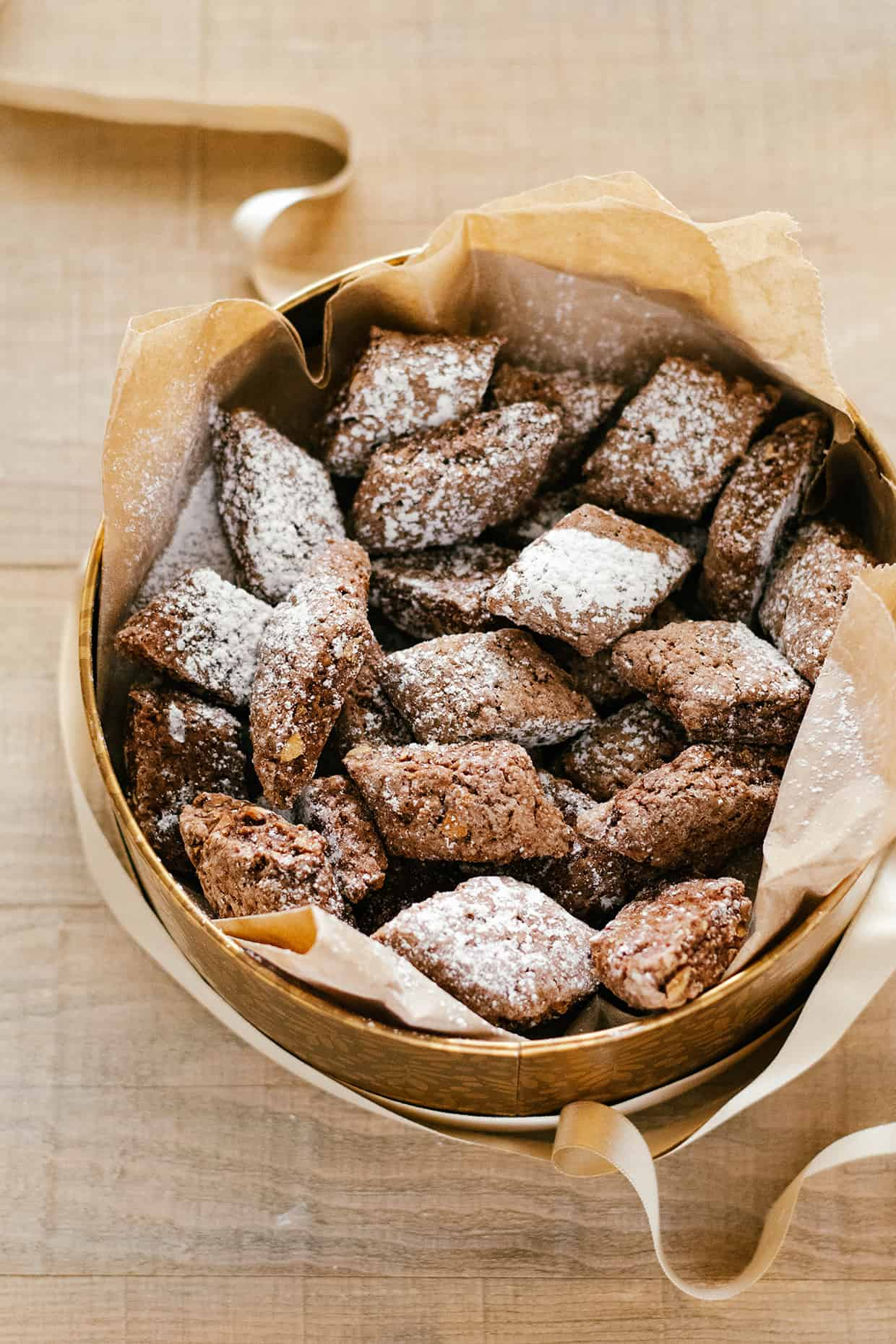 cocoa cookies in a golden round cookie metal box