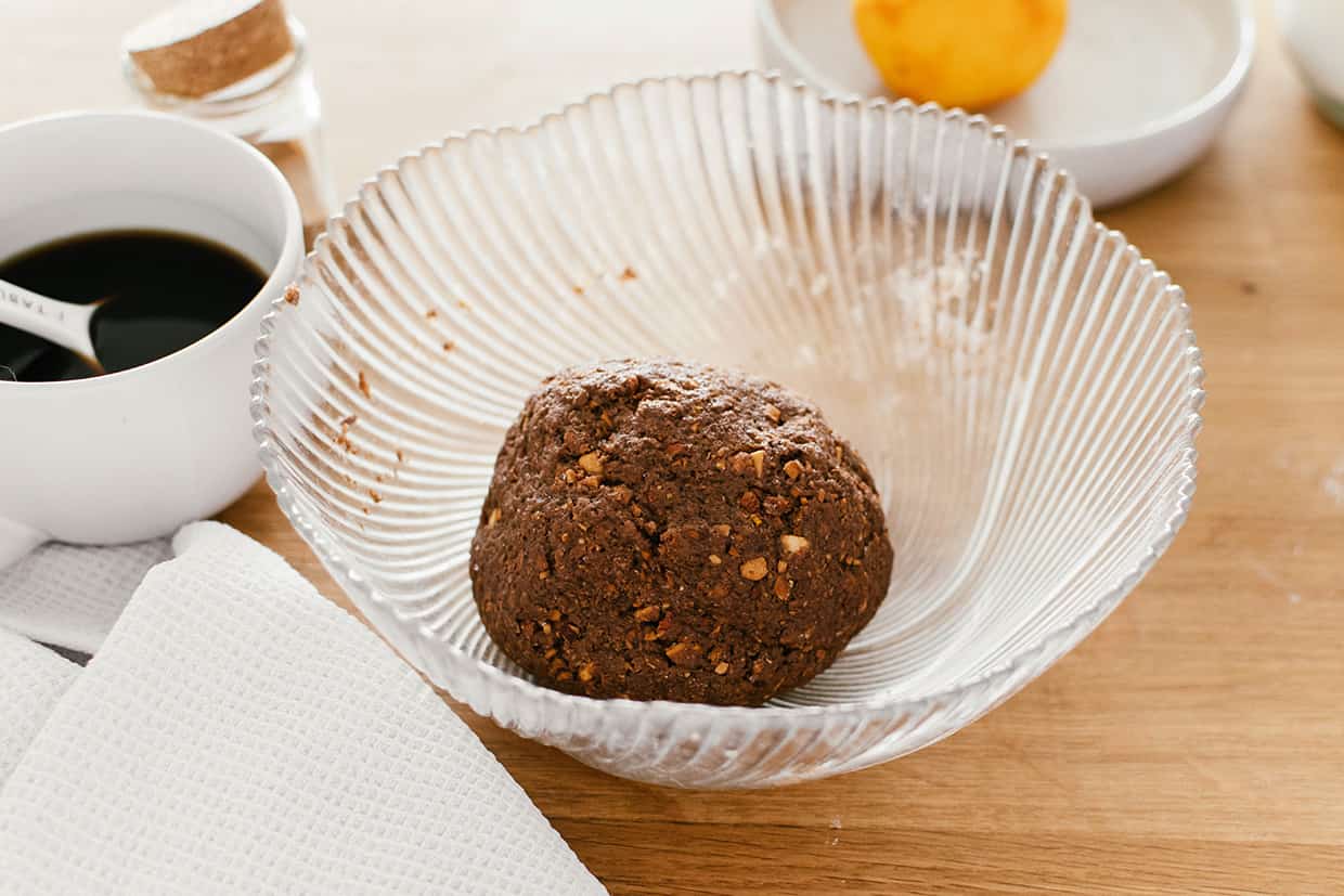 ball of raw cocoa almond cookie dough in a bowl