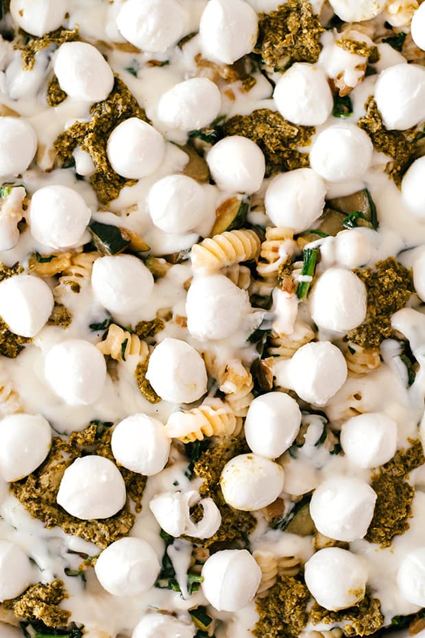 close view of zucchini pasta bake with mini mozzarella balls on top