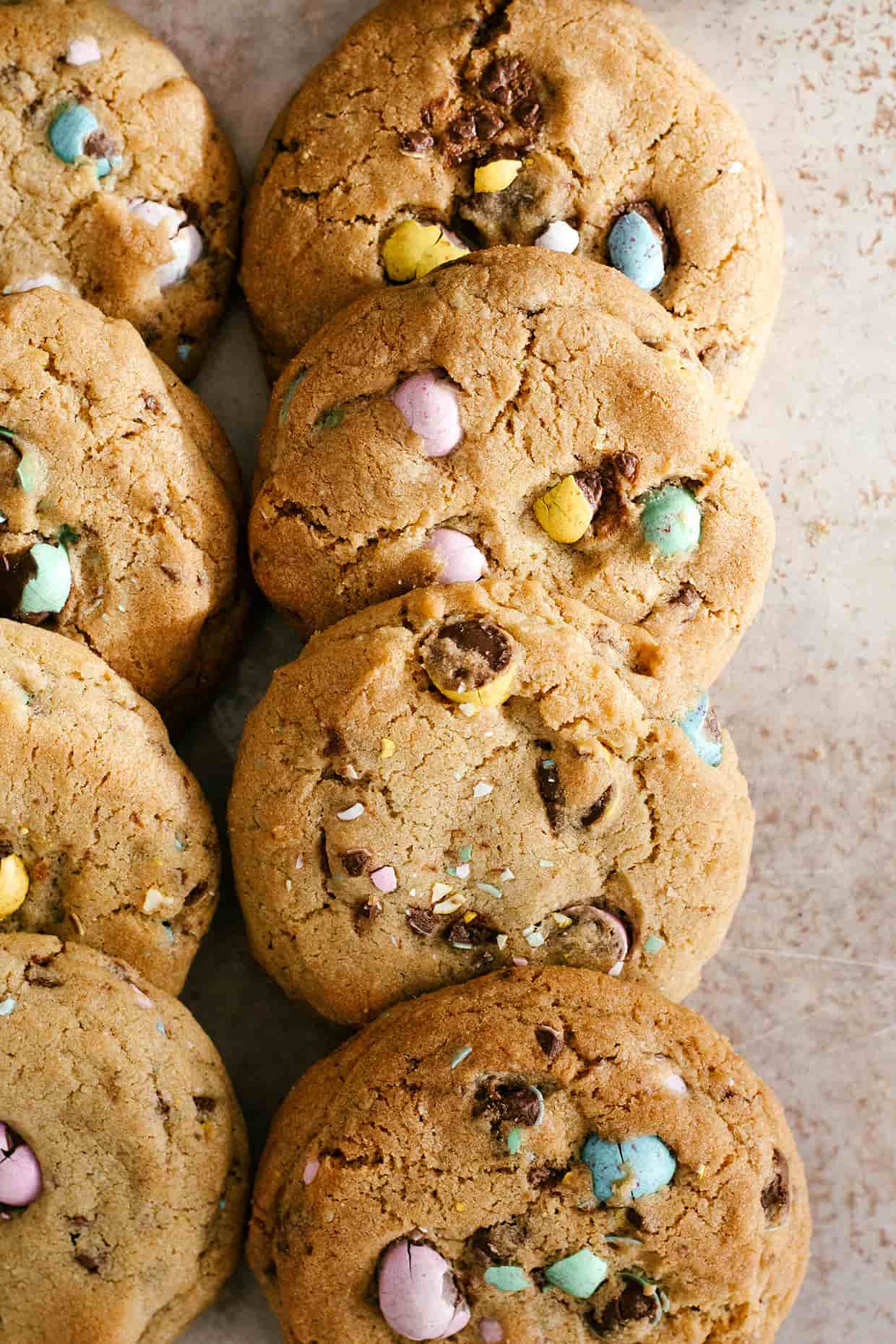 mini egg easter cookies stacked on a table
