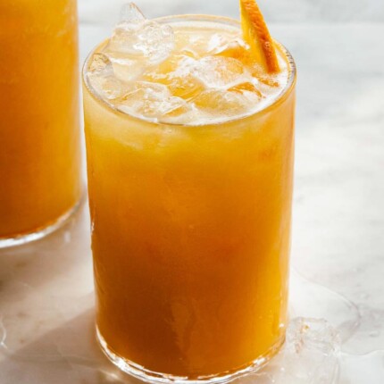 close view of carrot pineapple orange juice served over ice