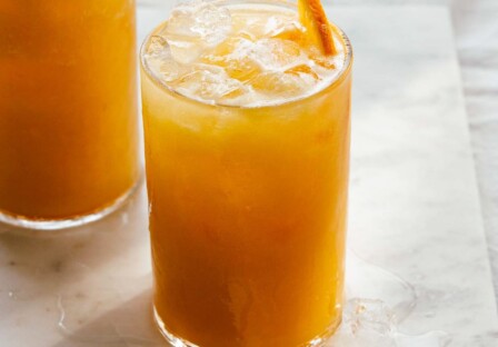 close view of carrot pineapple orange juice served over ice