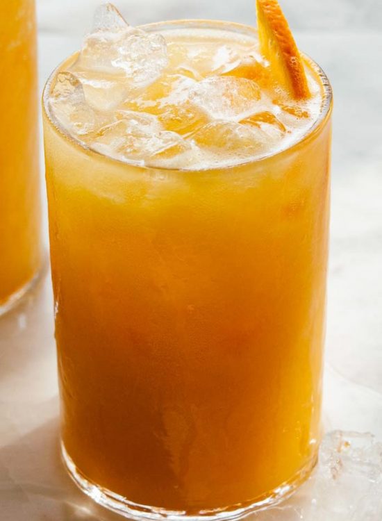 close view of carrot pineapple orange juice served over ice