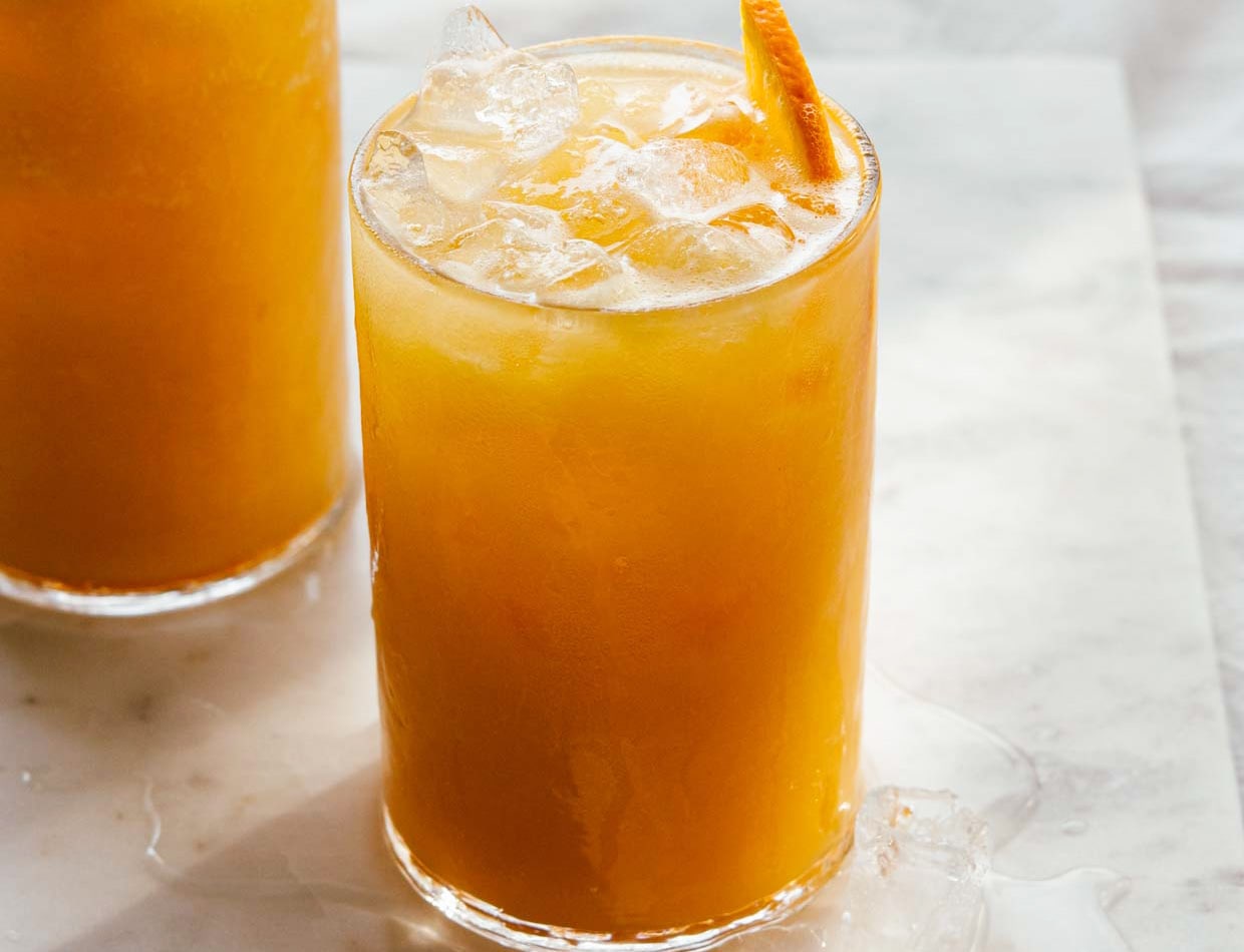 close view of carrot pineapple orange juice served over ice