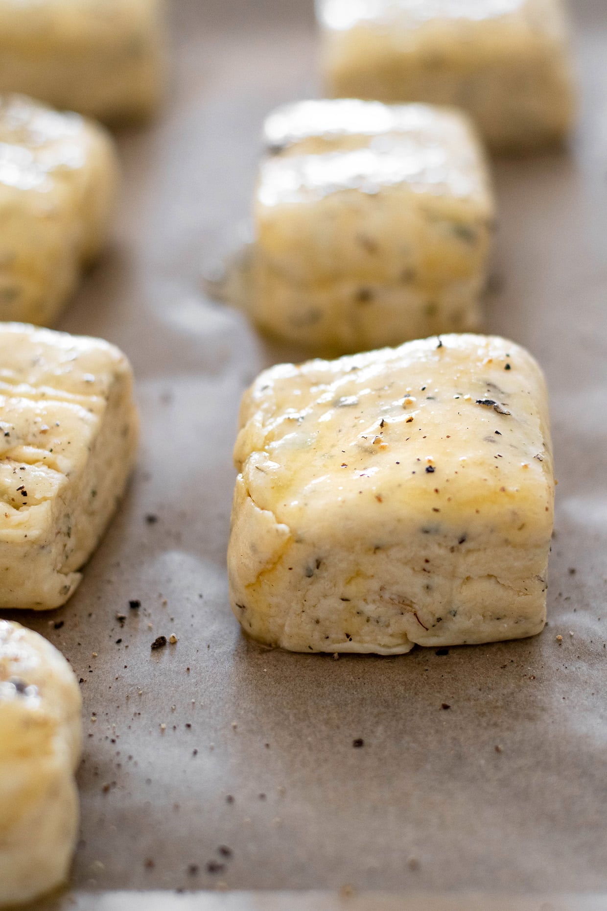 parmesan biscuits before baking, brushed with butter