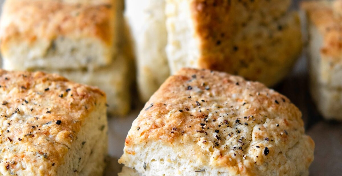 baked herb parmesan biscuits with black pepper on top