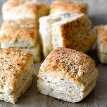 baked herb parmesan biscuits with black pepper on top