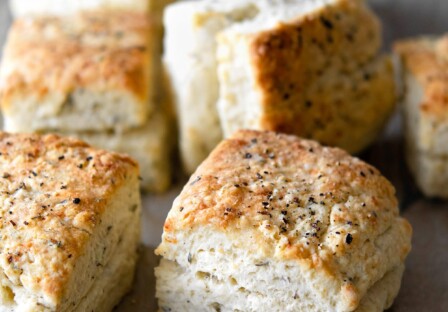 baked herb parmesan biscuits with black pepper on top