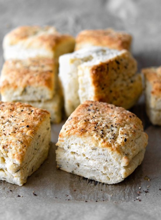 baked herb parmesan biscuits with black pepper on top
