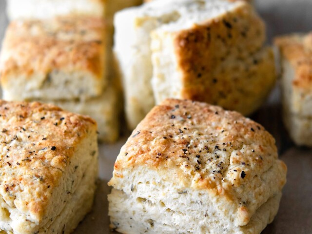 baked herb parmesan biscuits with black pepper on top