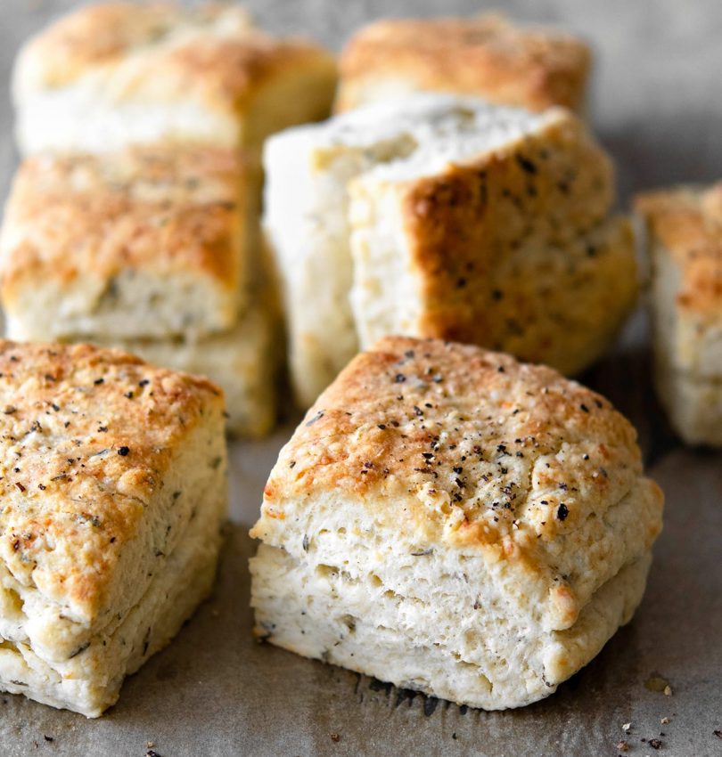 baked herb parmesan biscuits with black pepper on top