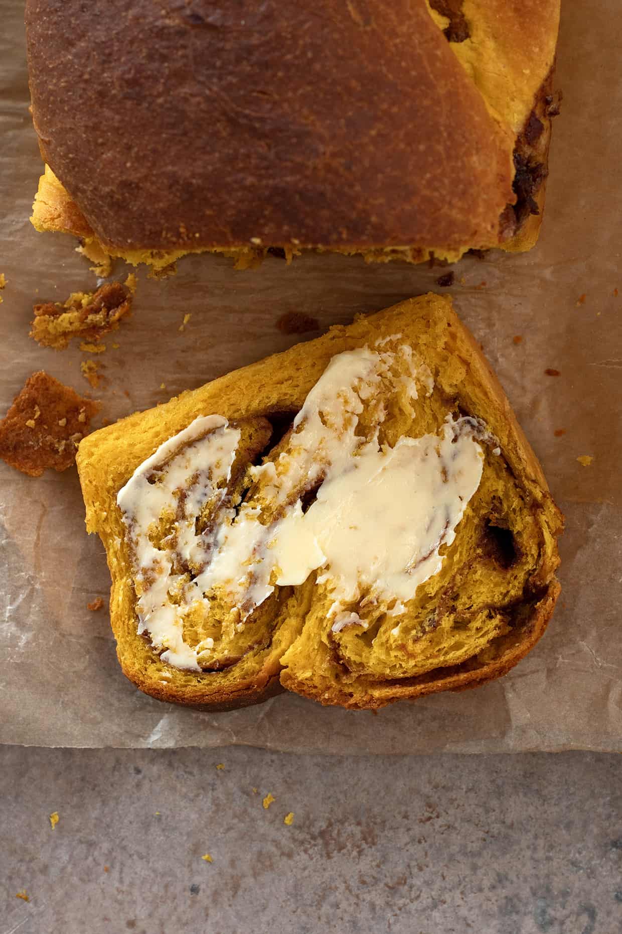 slice of cinnamon pumpkin brioche with butter