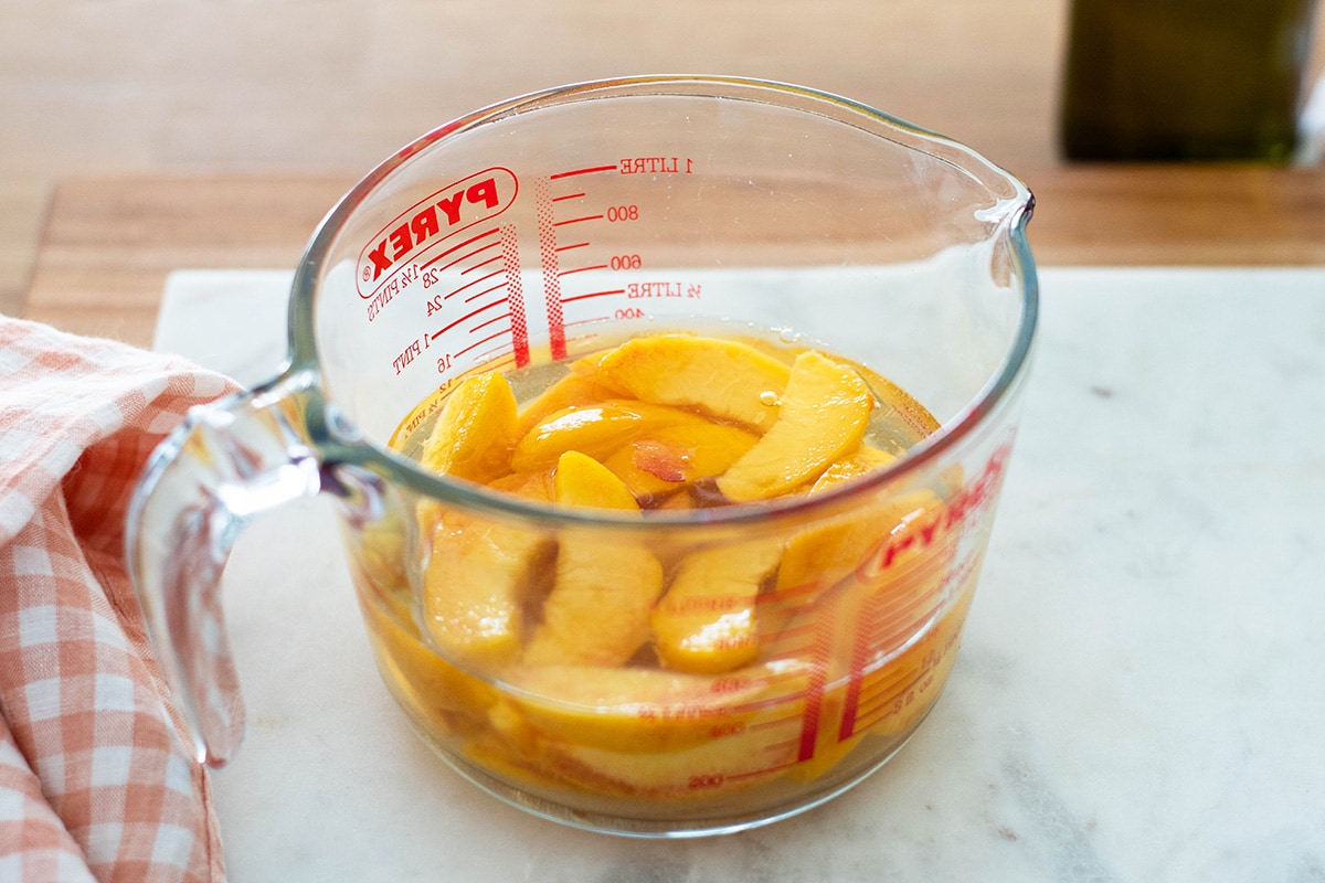 peeled sliced peaches in wine