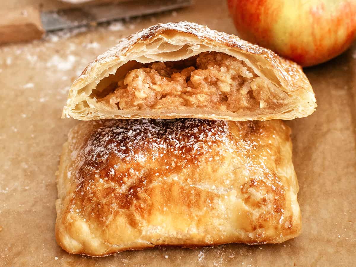 close view of sliced apple pie with puff pastry
