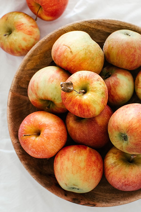 apples in a wood bowl
