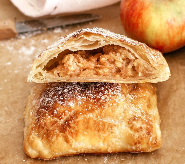 close view of sliced apple pie with puff pastry