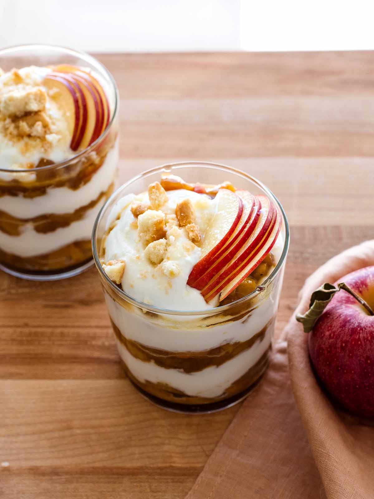 apples and greek yogurt layered in a glass jar