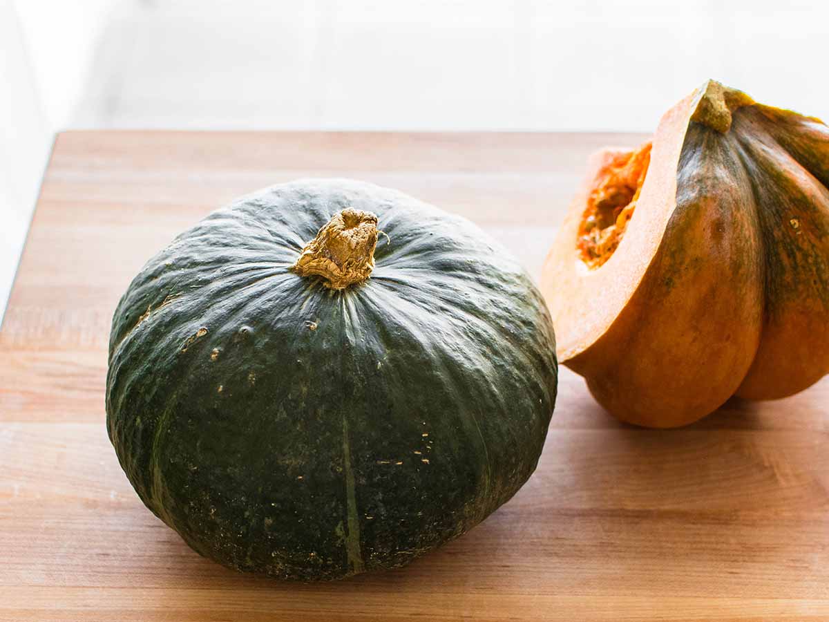 whole pumpkin on a wood board