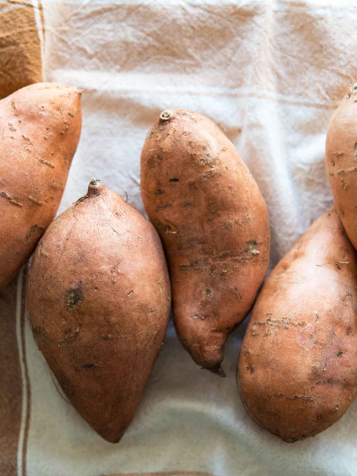raw whole orange sweet potatoes