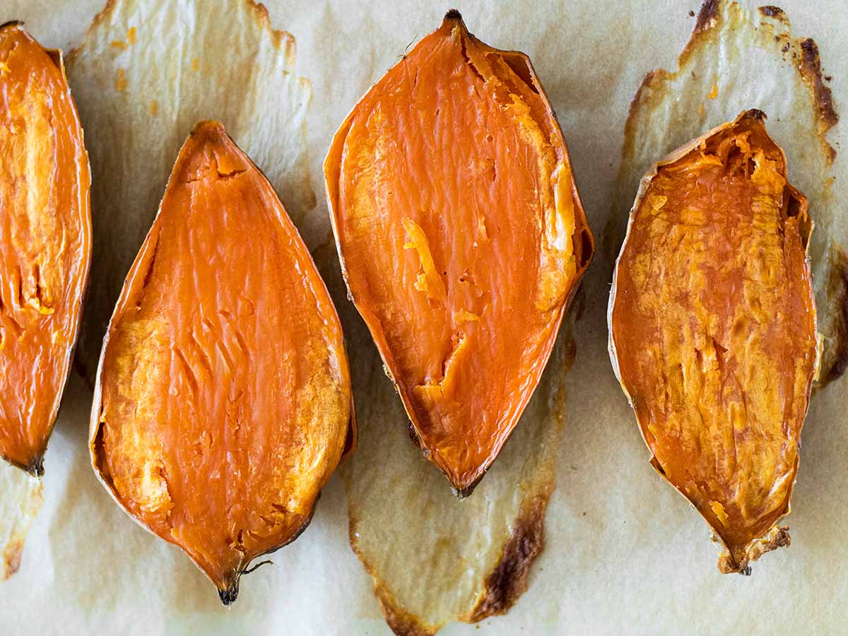 perfect oven baked sweet potatoes sliced in half