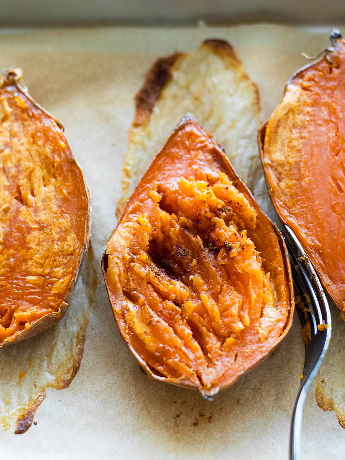 half of a sweet potato sprinkled with cinnamon