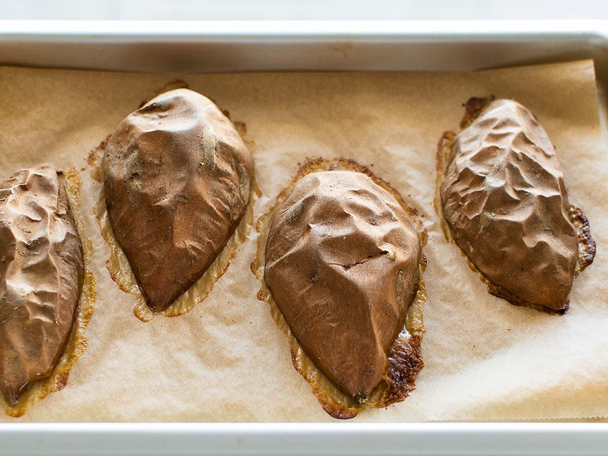 baked sweet potatoes on a baking sheet