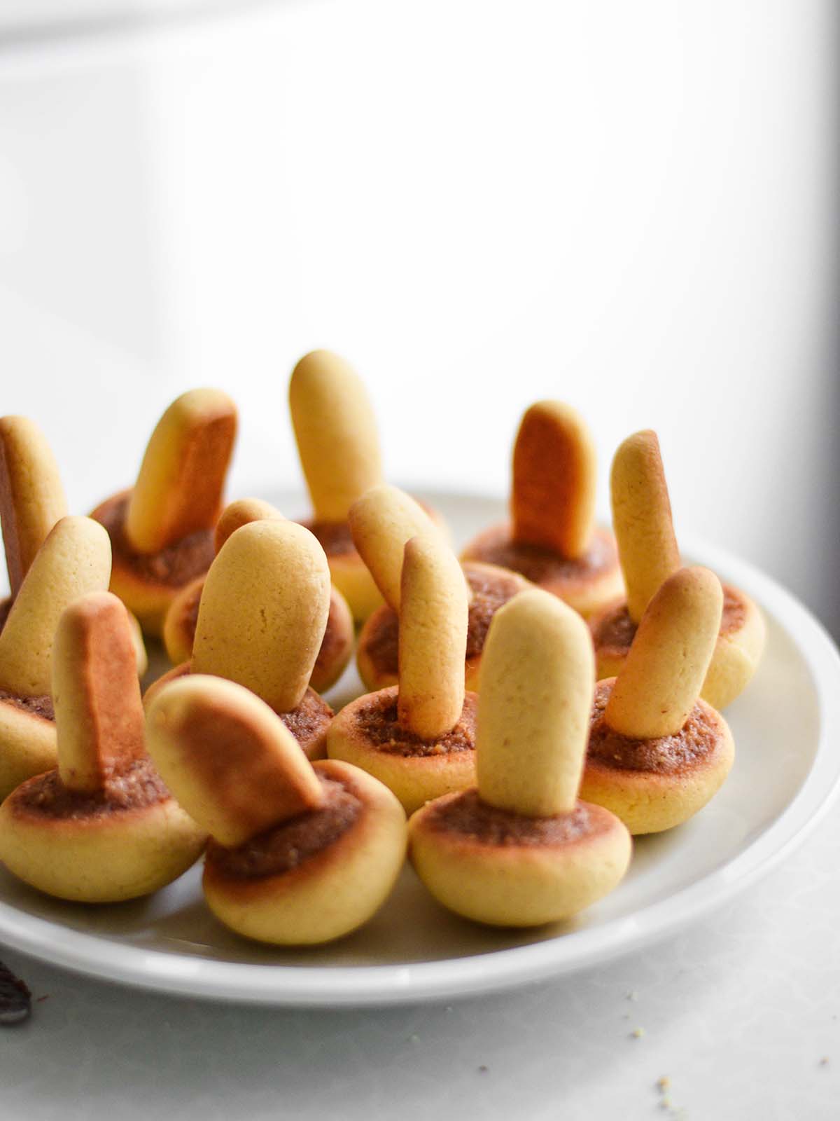a plate with mushroom shaped cookies