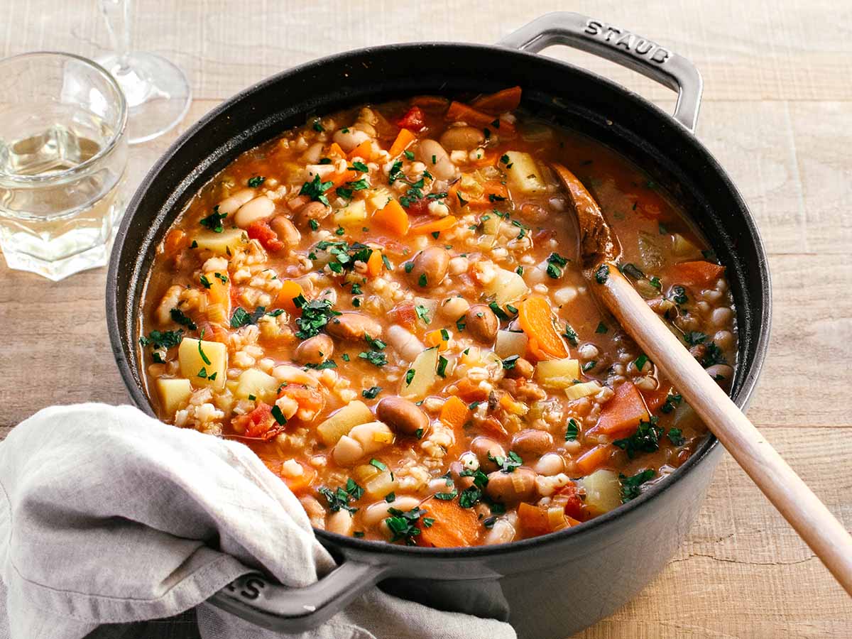 dutch oven with vegetable barley soup with potatoes