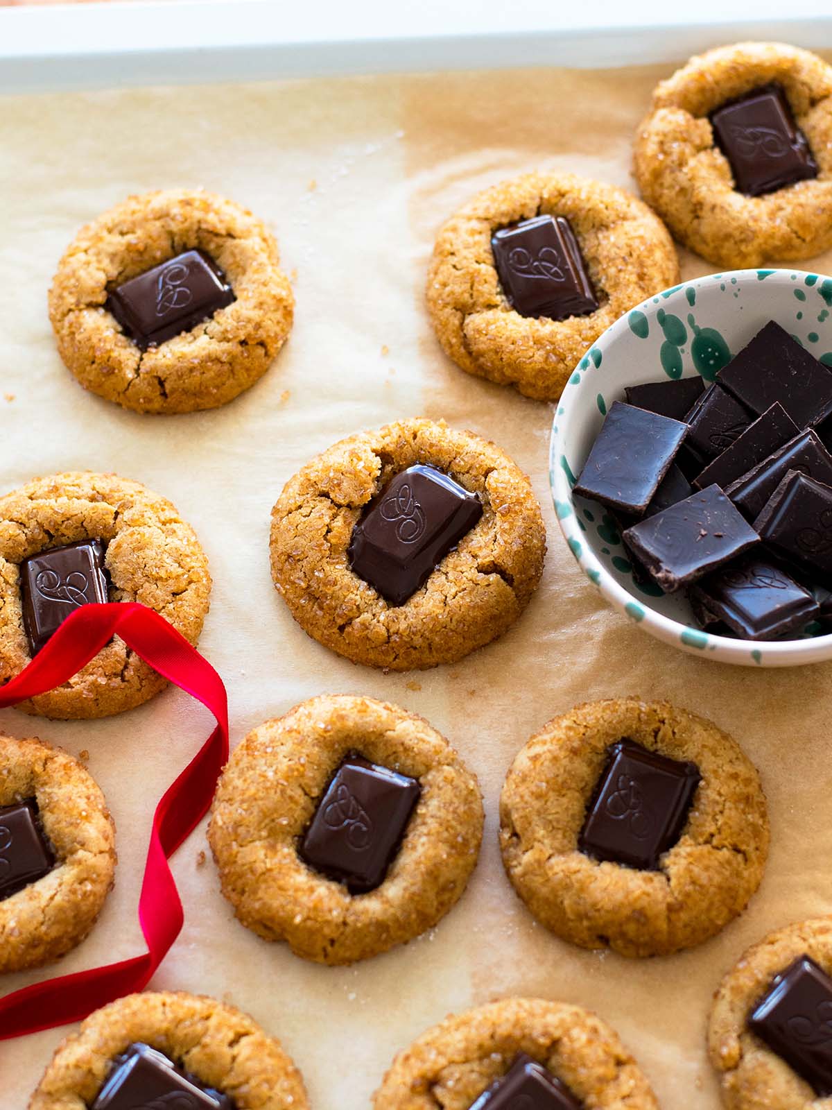 dark chocolate pieces on top of peanut butter cookies