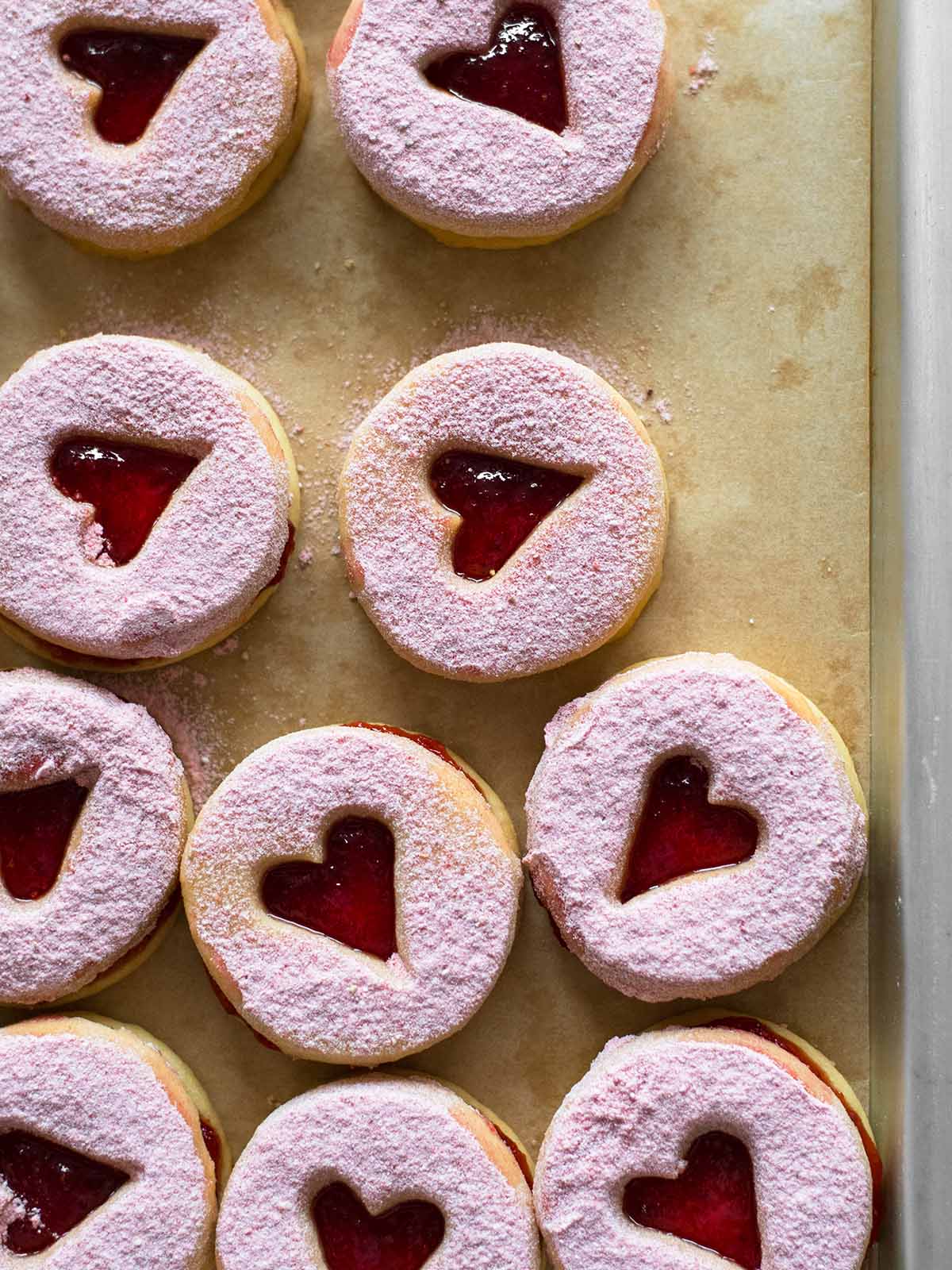 baked shortbread heart cookies with strawberry jam
